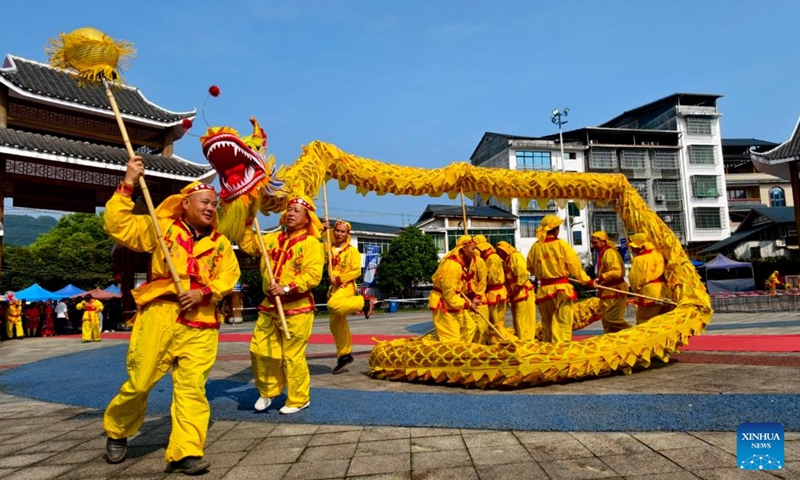People perform a dragon dance in an event celebrating the Sanyuesan Festival in Rong'an County of Liuzhou, south China's Guangxi Zhuang Autonomous Region, April 19, 2026. The Sanyuesan Festival is a traditional festival celebrated on the third day of the third lunar month by various ethnic groups in China, which falls on April 19 this year. (Photo by Tan Kexing/Xinhua)

